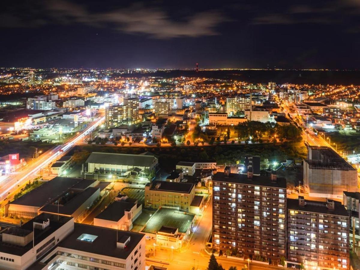 Hotel Emisia Sapporo Exteriör bild Aerial view of the city at night