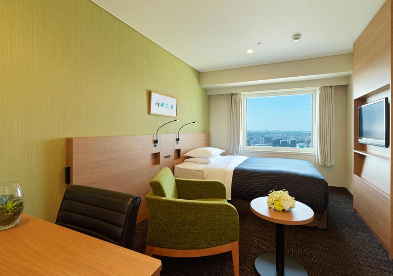 Hotel Emisia Sapporo Exteriör bild A room at the hotel